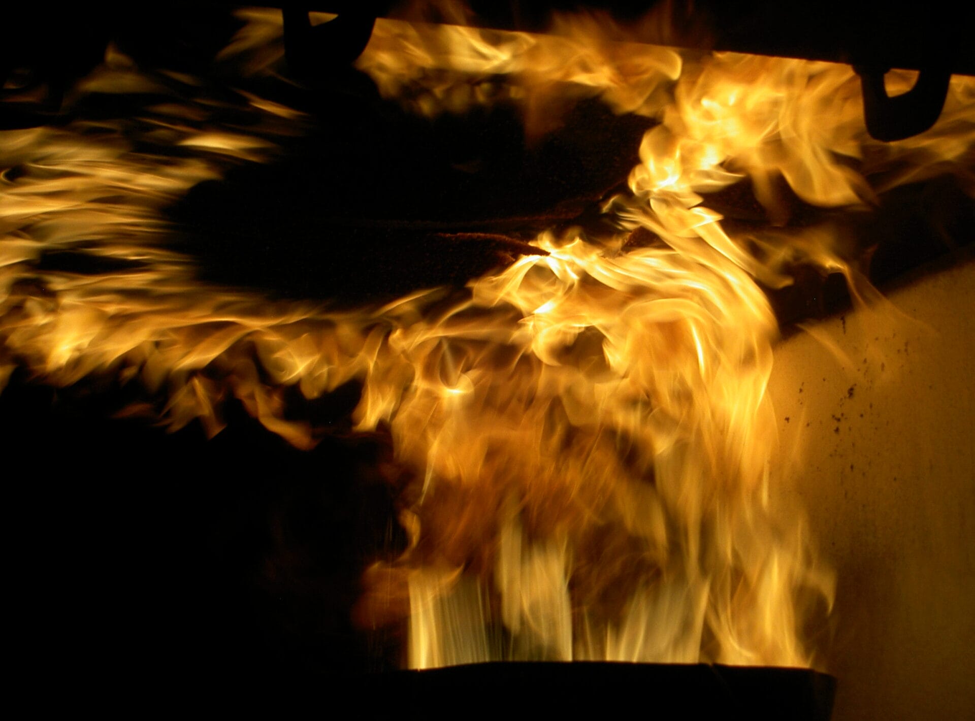 Aircraft component being blasted with fire in flammability testing lab