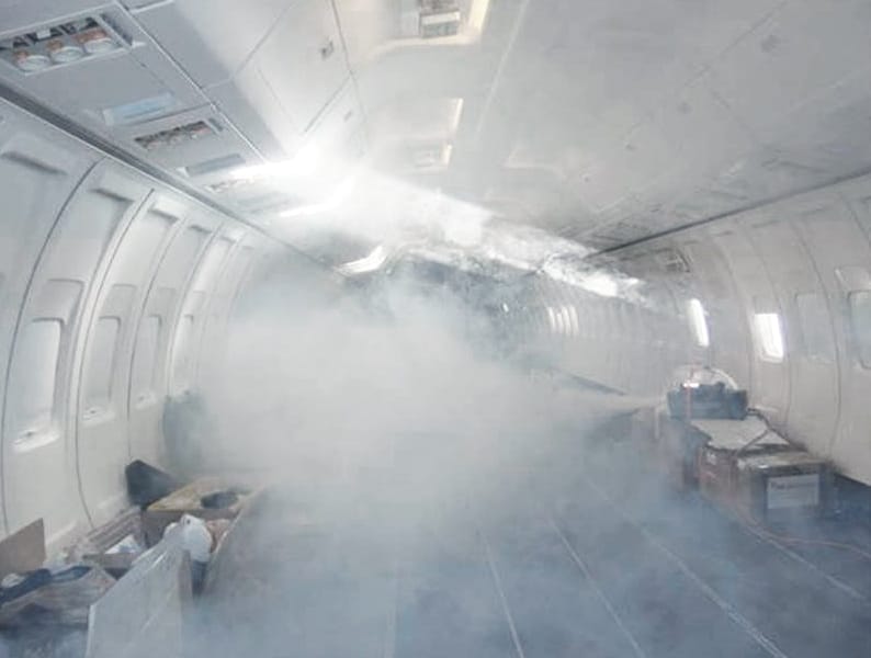 Photograph of an aircraft cabin filled with smoke