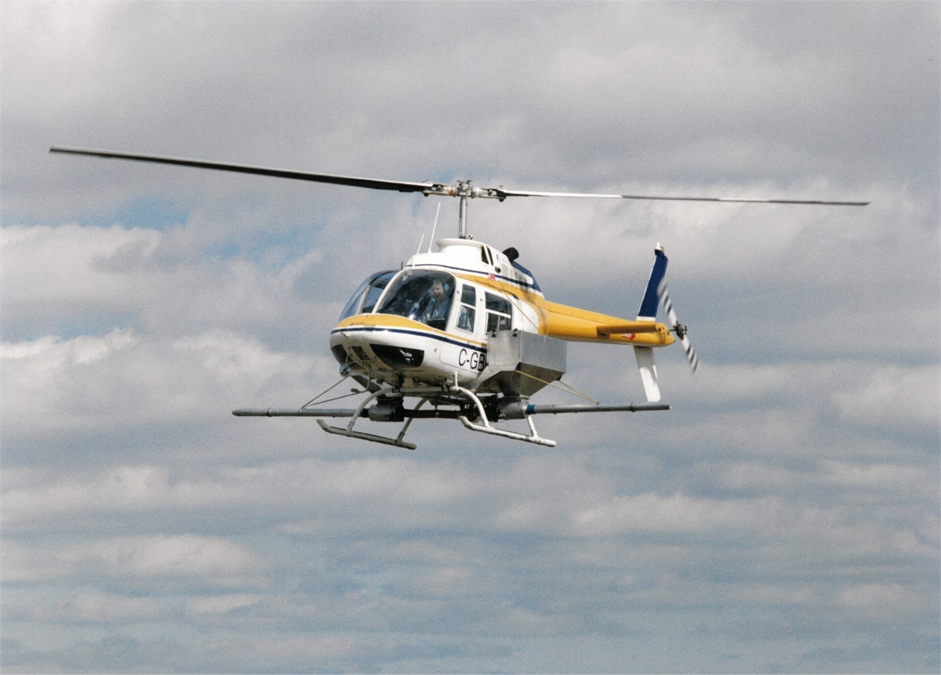Bell 206 helicopter modified for agricultural seeding.